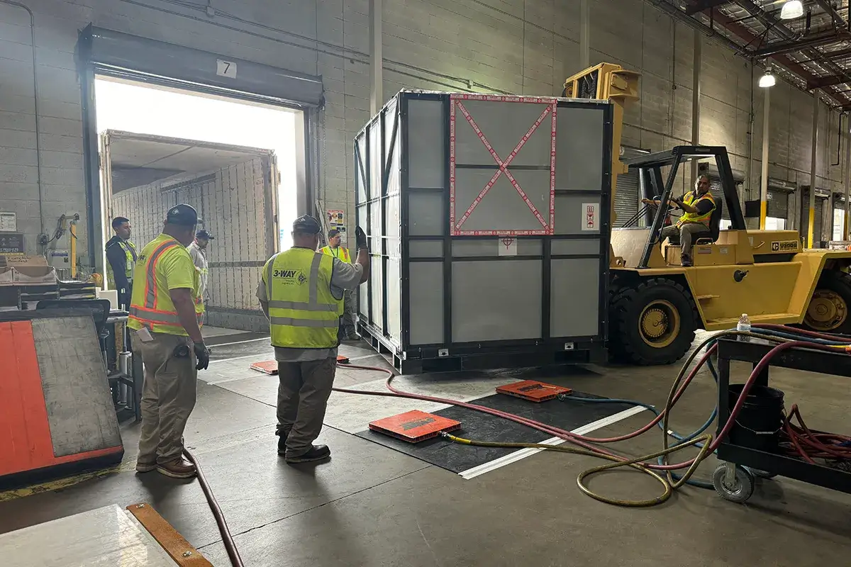 What Do Heavy Equipment Movers Los Angeles Specialize in? - 3-WAY Machinery movers moving a large piece of equipment