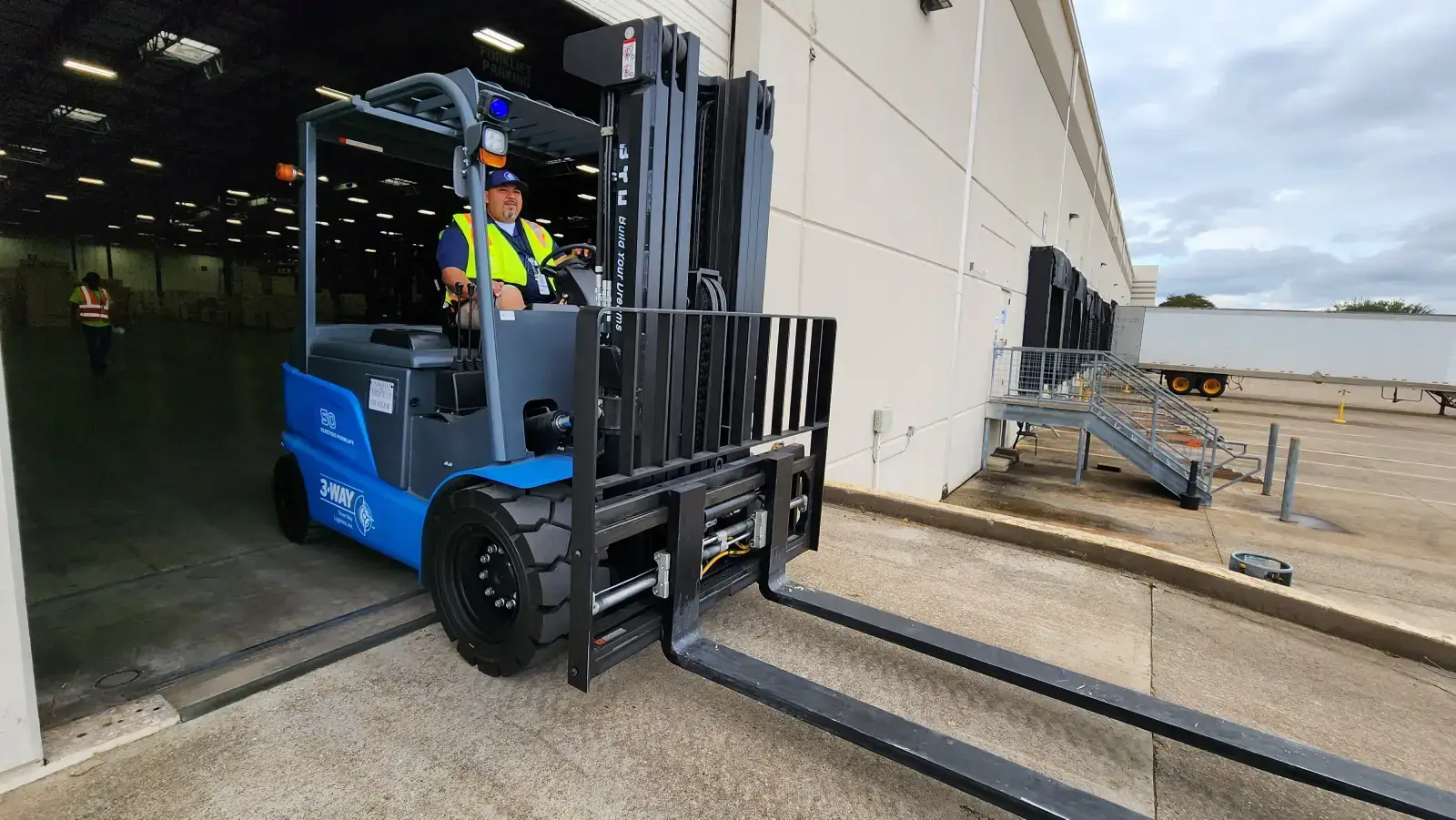 forklift man operating threeway