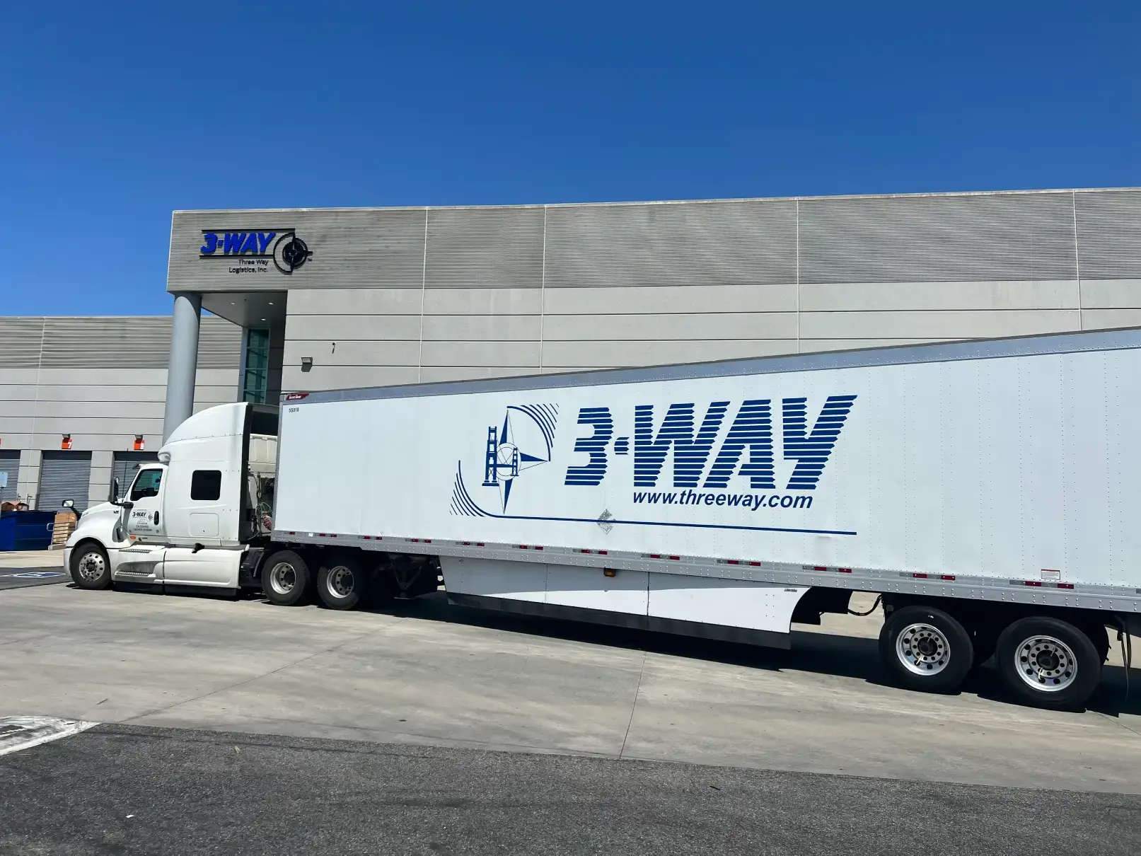 threeway truck infront warehouse