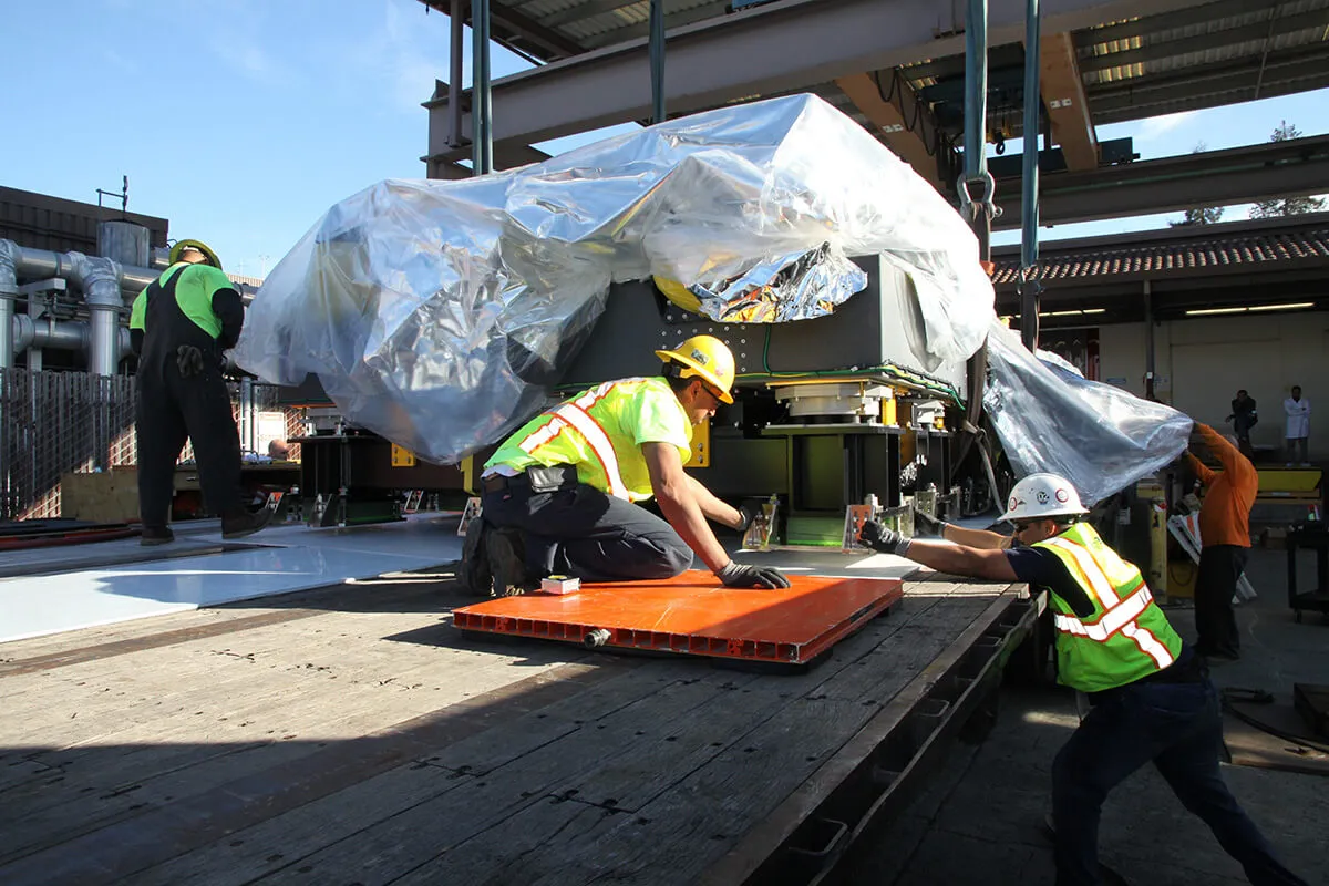 Machinery Moving in Dallas-Fort Worth: Tailored Rigging Solutions for Manufacturing & High Tech Equipment - 3-WAY A machinery rigger putting skates under machinery