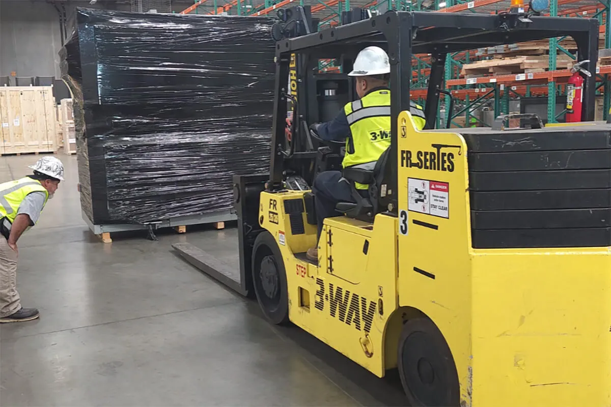 Machinery Moving in Dallas-Fort Worth: Tailored Rigging Solutions for Manufacturing & High Tech Equipment - 3-WAY A man driving a forklift