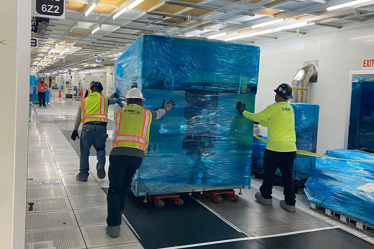 From Port to Production: A Turnkey Success Story - 3-WAY Three Way Logistics team members handling packaged equipment