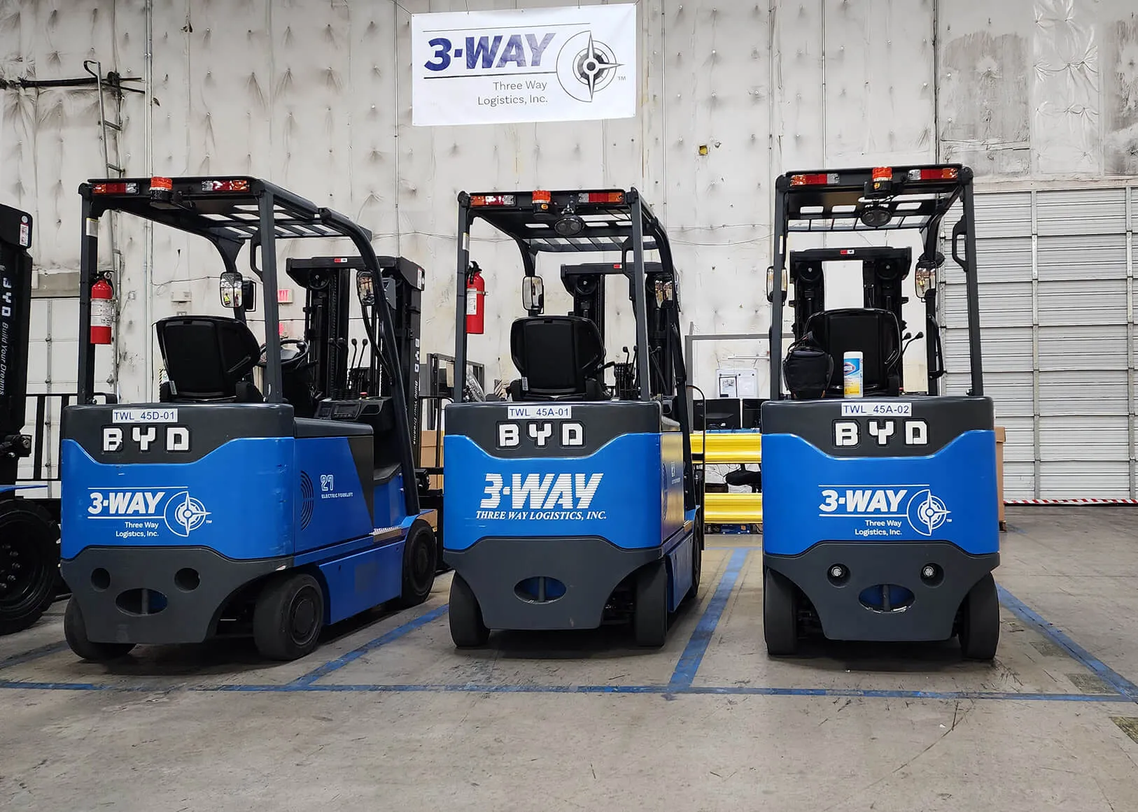 forklifts-in-warehouse Three forklifts at a 3PL warehouse Los Angeles